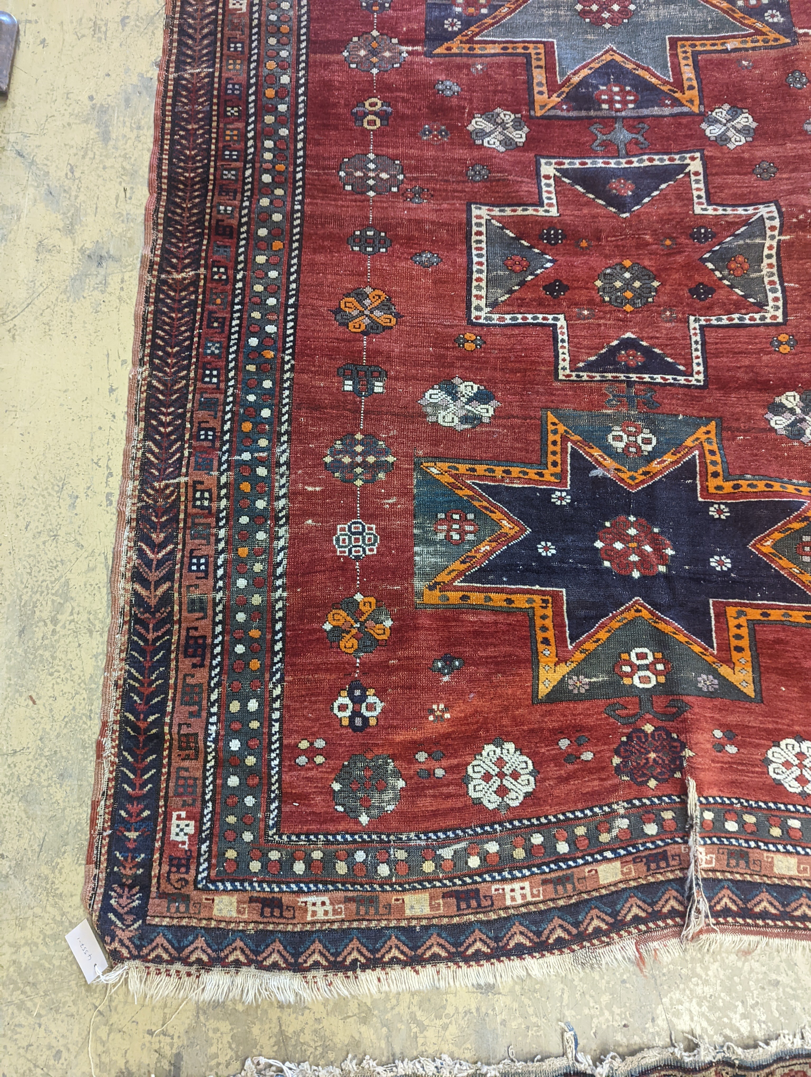 A Kazak red ground rug, 210 x 160cm